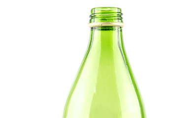 Glass green bottle of mineral water close-up isolated on white background