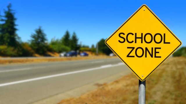 4K School Zone Yellow Diamond Sign, Traffic Road Sign, Seamless Looping