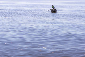 Brazil, State of Rio de Janeiro, Paqueta Island, Man on a fishing boat