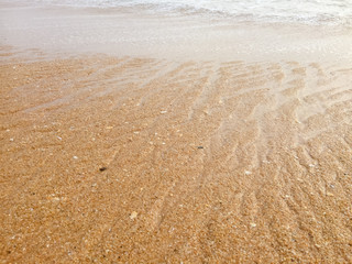 Fototapeta na wymiar Natural sandy surface ocean sea beach backdrop top view background