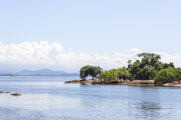 Fototapeta na wymiar Brazil, State of Rio de Janeiro, Paqueta Island, View of small island with mountains on the background