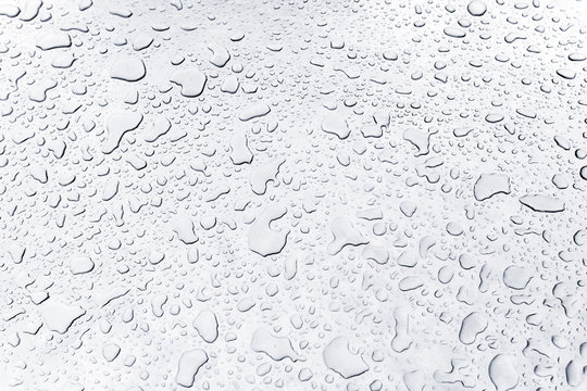 Drops Of Water On Silver Metallic Surface