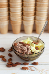 Melon and Chocolate ice cream with almonds in the background waffle cups