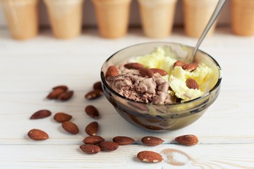 Melon and Chocolate ice cream with almonds in the background waffle cups