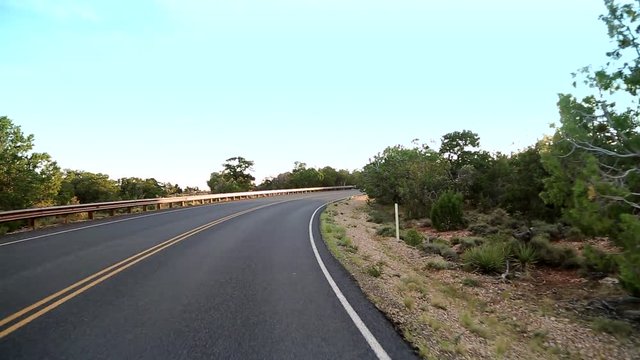 A car drives at Highway, cutting the desert of Arizona with and indescribable beauty. View of the passenger that travels to painted desert, through a lava field and opens up to the State Mo