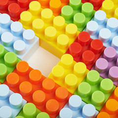 Surface covered with toy bricks