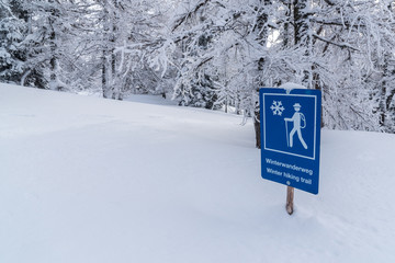 Blue sign of the road for hiking