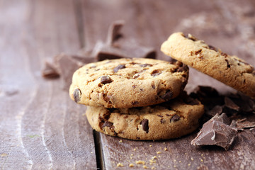 Chocolate cookies on wooden table. Chocolate chip cookies shot