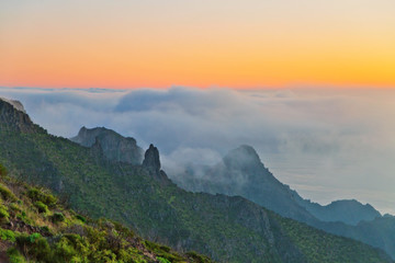 sunset over the mountains in the clouds