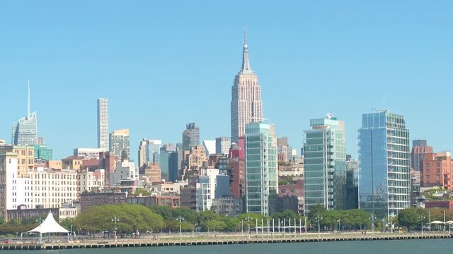 Ferry sightseeing cruise on Hudson River overlooking Midtown Manhattan skyline