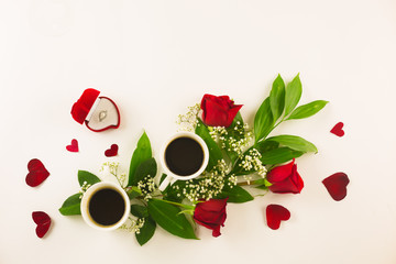 Valentine still life with pearl ring in man hand, red roses and woman hand with coffee