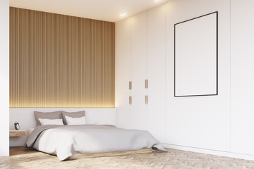 Corner of bedroom with wooden floor
