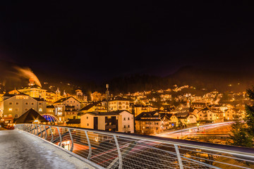Fototapeta na wymiar night view of modern bridge to mountain village