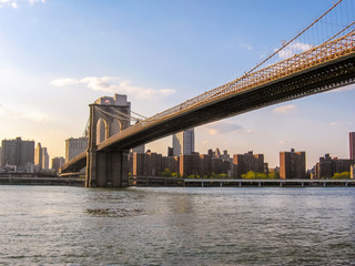 Fototapeta na wymiar Brooklyn bridge and financial district seen from the Circle Line Cruises on Hudson river, New York, USA.