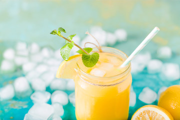 Orange juice. Orange smoothie on a turquoise background..Kiwi. Cocktails. Detox Juice. Summer drink. Healthy food concept