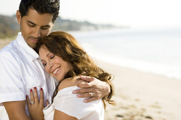 Beautiful Hispanic couple laughing and smiling.