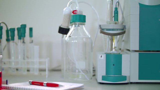 Chemical research equipment. Automatic titrator in the biochemical laboratory. Modern chemical equipment in biotechnology lab. Chemical laboratory research