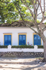 Brazil, State of Rio de Janeiro, Paqueta Island, Front view of colonial style house under bright light