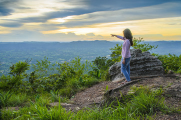 Naklejka premium Woman of Light sky sunset
