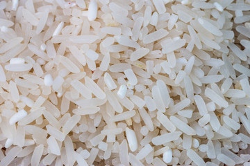Raw white rices background.