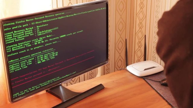 Hacker theft working with computer. Great video for and project involving cyber criminality and thief.