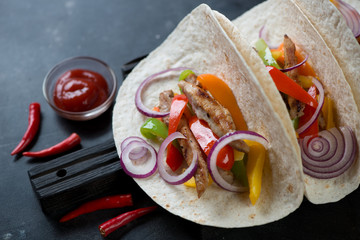 Close-up of wheat wraps filled with tex-mex pork fajitas