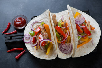 Tortillas with traditional tex-mex pork fajitas, high angle view