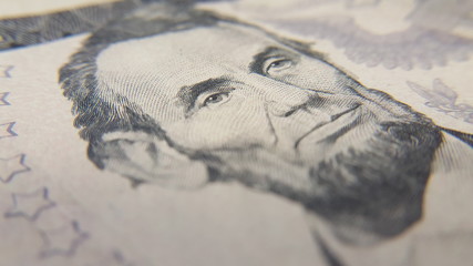 Closeup of Abraham Lincoln on Five Dollar Bill