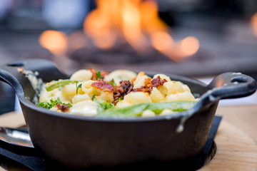 Shallow depth of field macaroni and cheese with fire