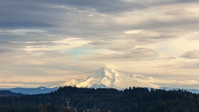 Ultra high definition 4k time lapse movie of moving white clouds and blue sky over snow covered mount Hood in Portland Oregon 4096x2304 uhd