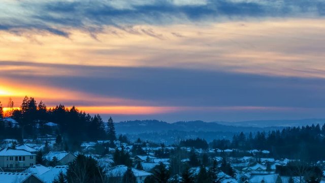 Time lapse movie of beautiful sunset over suburban residential homes in Happy Valley Oregon on a snowy winter evening 4096x2304 4k uhd