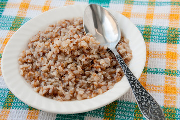 Buckwheat porridge for breakfast in a plate