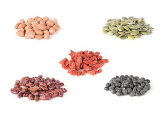 Dry pumpkin seeds, peanuts, beans, wolfberry on white background.