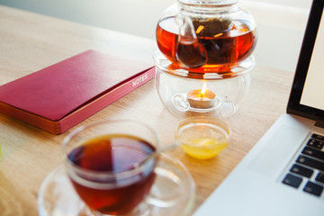 Hot drink with working accessories stand on table