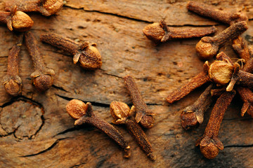 Dried cloves on an old board