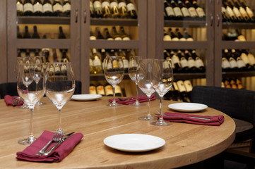 Restaurant table with wine fridge in the background