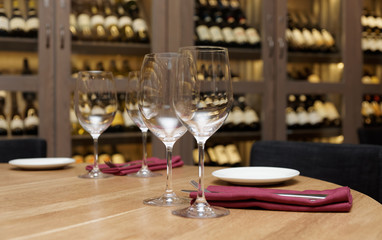 Restaurant table with wine fridge in the background