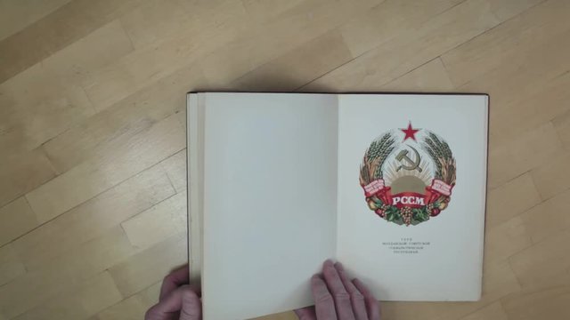  flipping book with pictures time lapse overhead shot