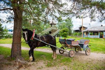 Old carriage in russian tourist center Verhnie Mandrogi