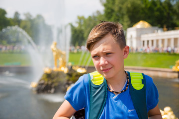 Teen on a background of Grand Cascade at Peterhof
