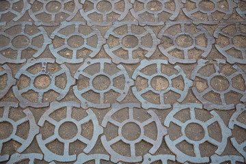 Paving blocks made of cast iron on pavement in Kronstadt