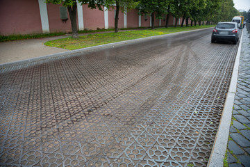 Paving blocks made of cast iron on the road in Kronstadt