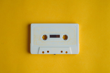 Old audio tape on a yellow background. Music concept
