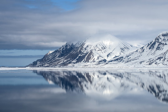 Mountain reflection with snow