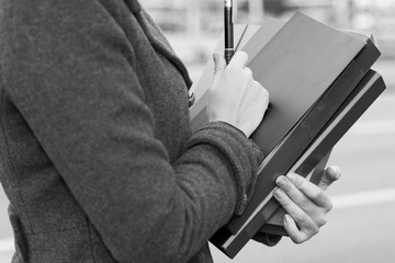 Young Business Woman Hands Holding Folders on the Street