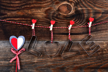 Silver text Love and heart for Happy Valentine's Day celebration on a beautiful old wooden background