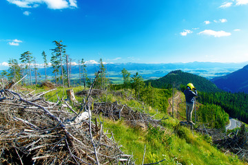 quad racer with helmet in highland landscape looking for his path.