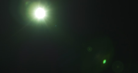 green lens flare artifacts over black background for overlay, 4k photo