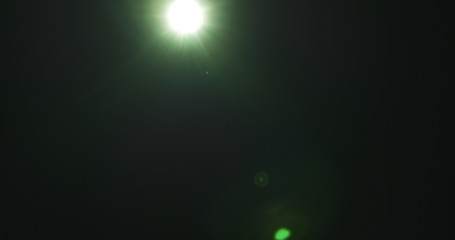 green lens flare artifacts over black background for overlay, 4k photo