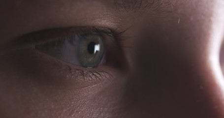 Closeup of teenage girl eye without makeup looking straight, 4k photo